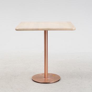A steel and oak table by Jonas Lindvall 2011.