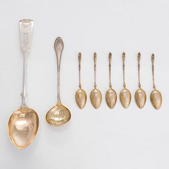 Six gilt coffee spoons, a parcel-gilt serving spoon and sifter spoon, maker's mark of Hj. Fagerroos, Helsinki 1896-1929.