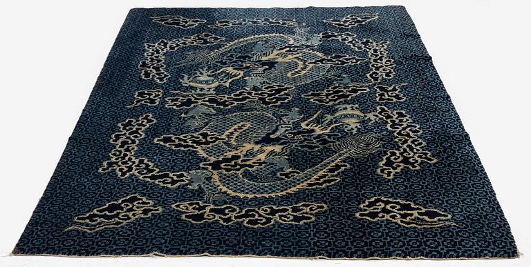 A Chinese 'dragon' rug, circa 1920. (c 190x122 cm).