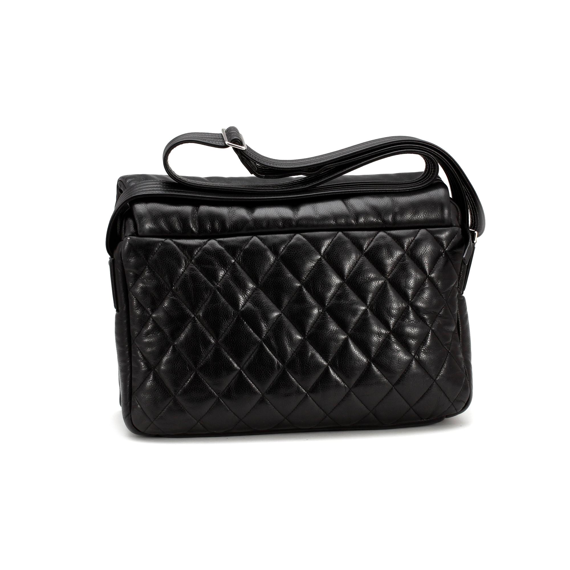 CHANEL, a quilted black mens messenger bag.