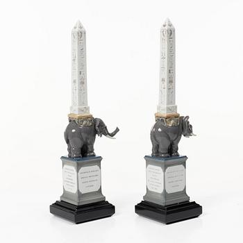 Lladró, figurines, a pair, "Pulcini obelisk enamels left" and "Pulcini obelisk enamels right", Spain.