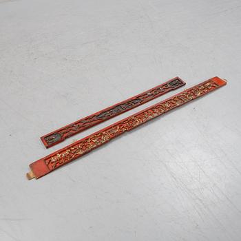 Two Chinese red lacquered wooden panels, 20th century.