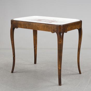 A porcelain traytop table by Nordiska Kompaniet and presumably Rörstrand.