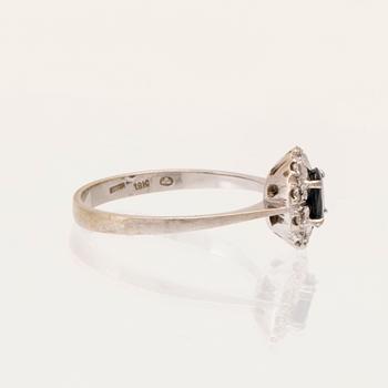 An 18K white gold carmosé ring set with an oval faceted sapphire and round brilliant-cut diamonds, Alessandria Italy.