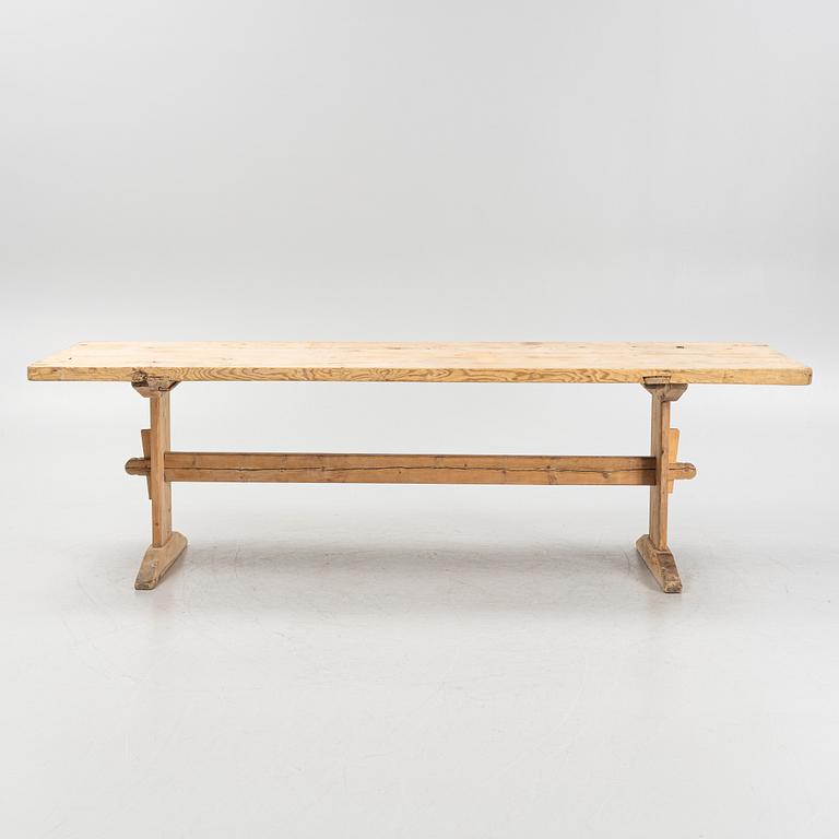 A pinewood trestle table, 18th Century.