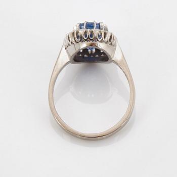 An 18K whithe gold ring set with a faceted sapphire weight 3.93 cts according to engraving.