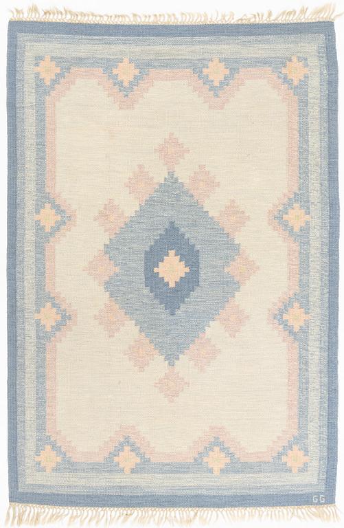 A flat weave carpet, signed GG, ca 236 x 161 cm.