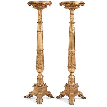 A pair of Swedish Empire giltwood gueridons, Stockholm, first part of the 19th century.