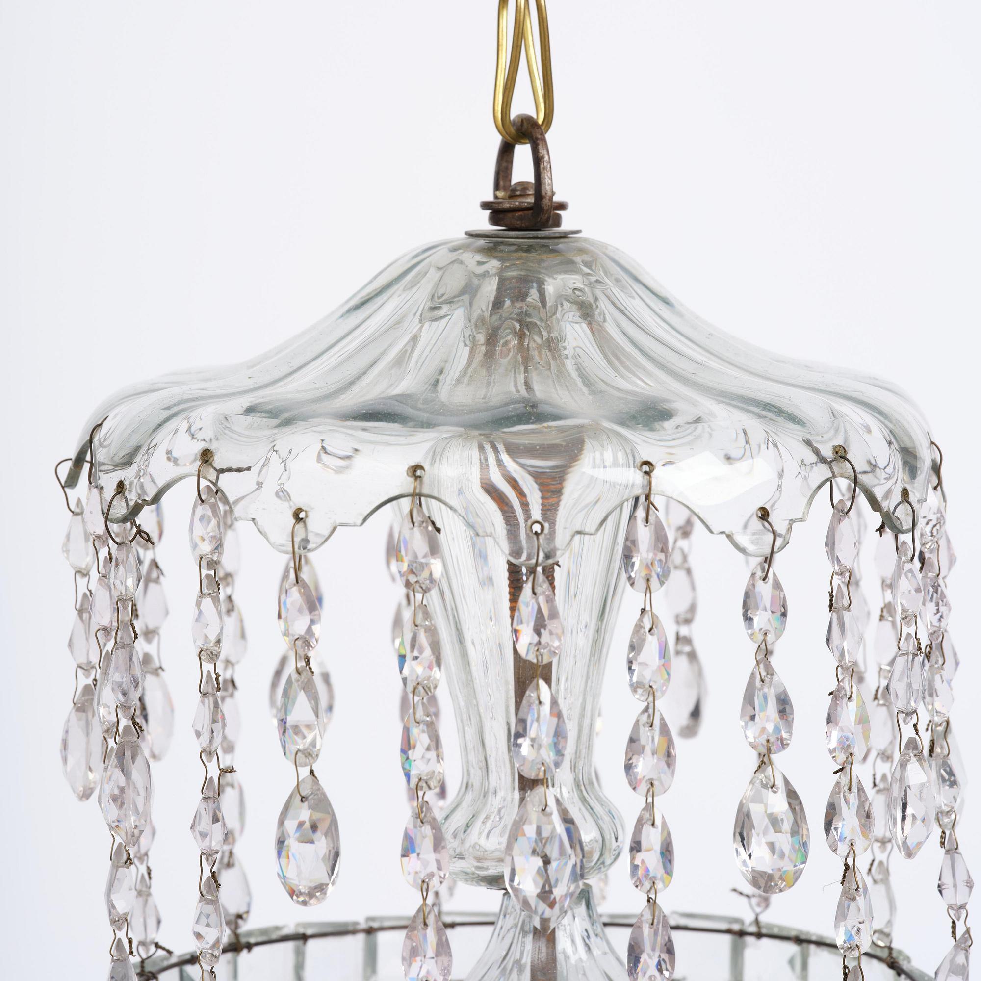A Bohemian Louis XVI moulded and cut-glass six-branch chandelier, late 18th century.