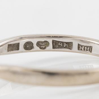 Ring in 18K white gold set with a brilliant-cut diamond.