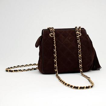 CHANEL, a brown suede purse.