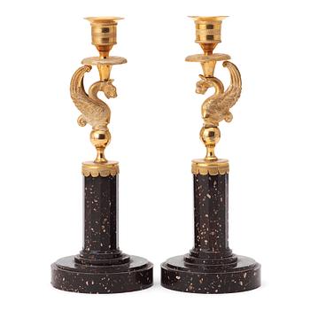 57. A pair of late Gustavian early 19th century porphyry and ormolu candlesticks.