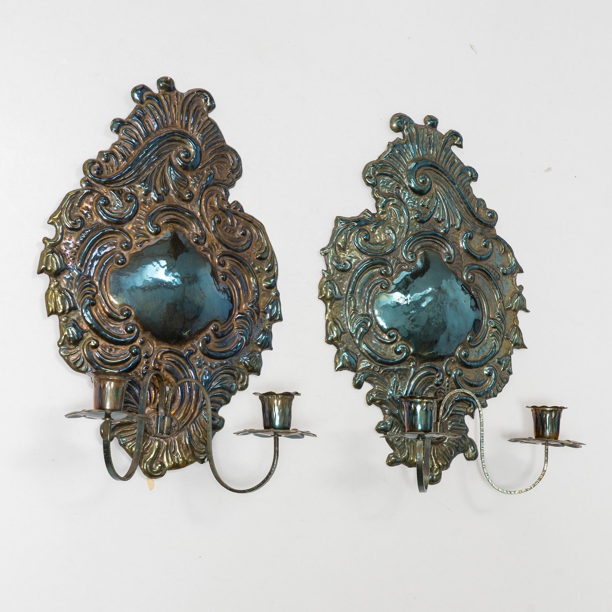 A pair of Rococo-style silver-plate sconces, early 20th century.