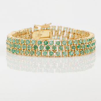 ARMBAND, förgyllt silver och smaragder.