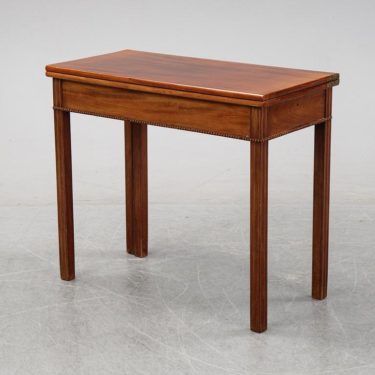 A mahogany games table, circa 1800.
