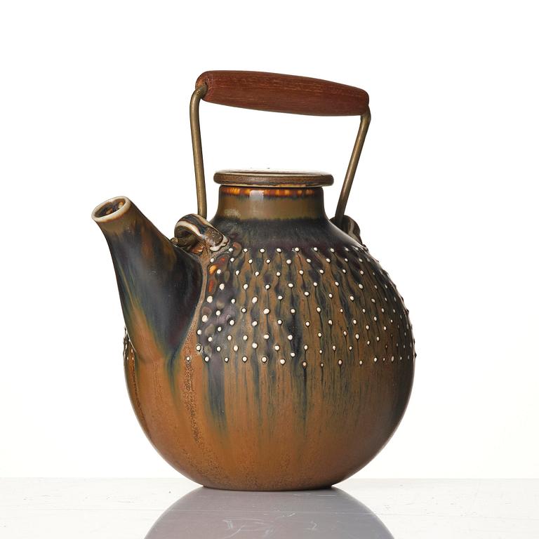 a stoneware teapot and 4 bowls, Gustavsberg Studio, Sweden, 1960-63.