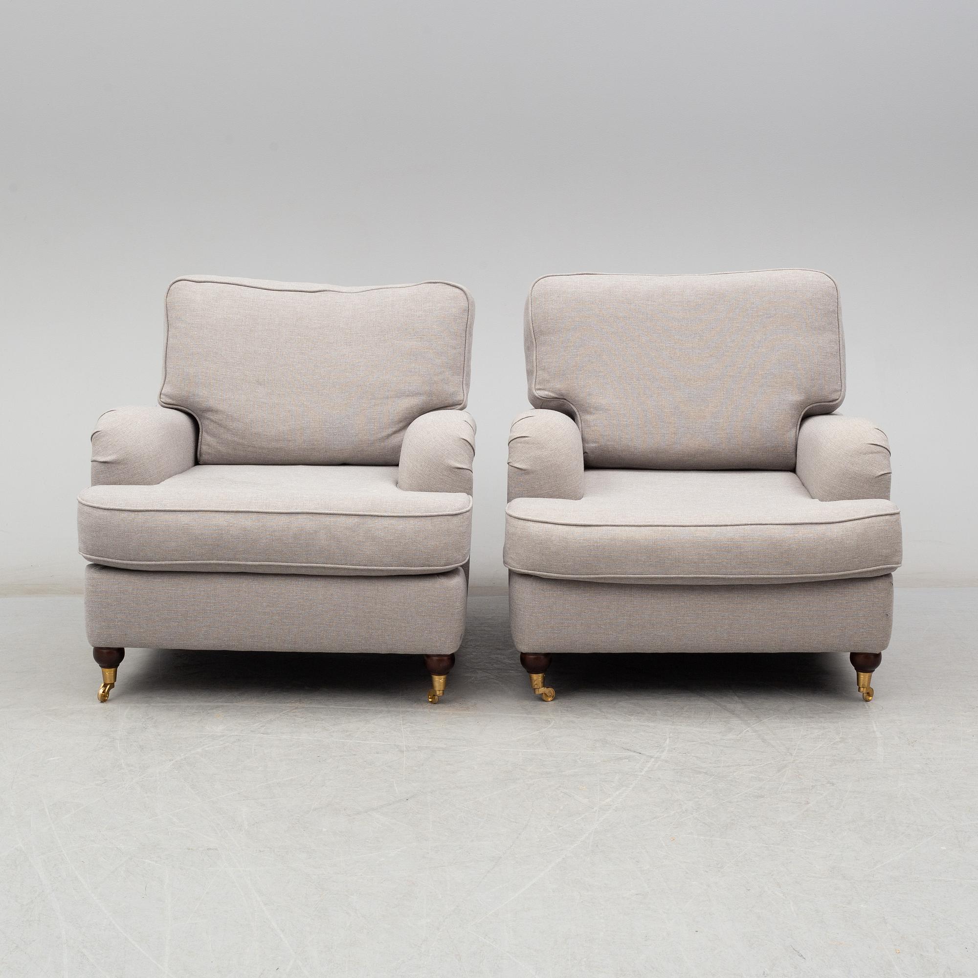 A 21st Century pair of Howard lounge chairs.