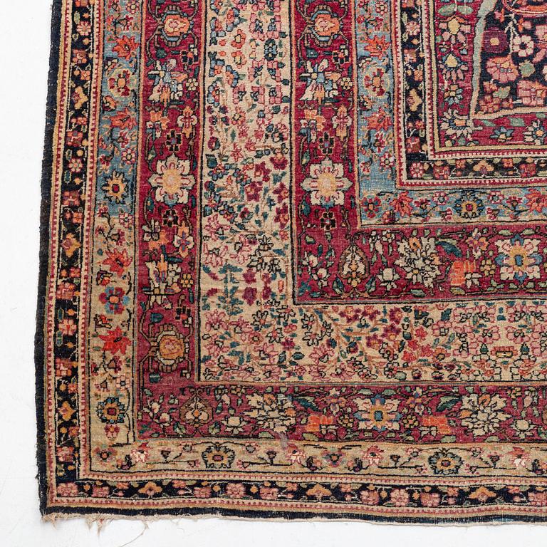 An antique Kerman Laver carpet, c. 586 x 385 cm.