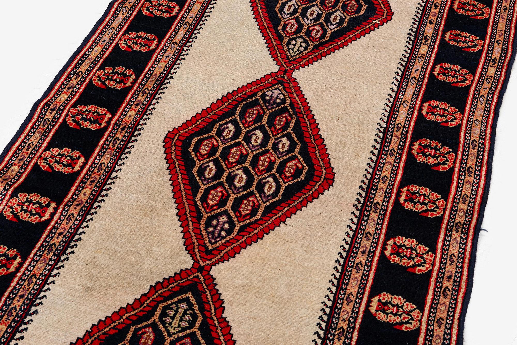 A semi-antique Northwest Persian (Iran) runner, c. 417 x 112 cm.