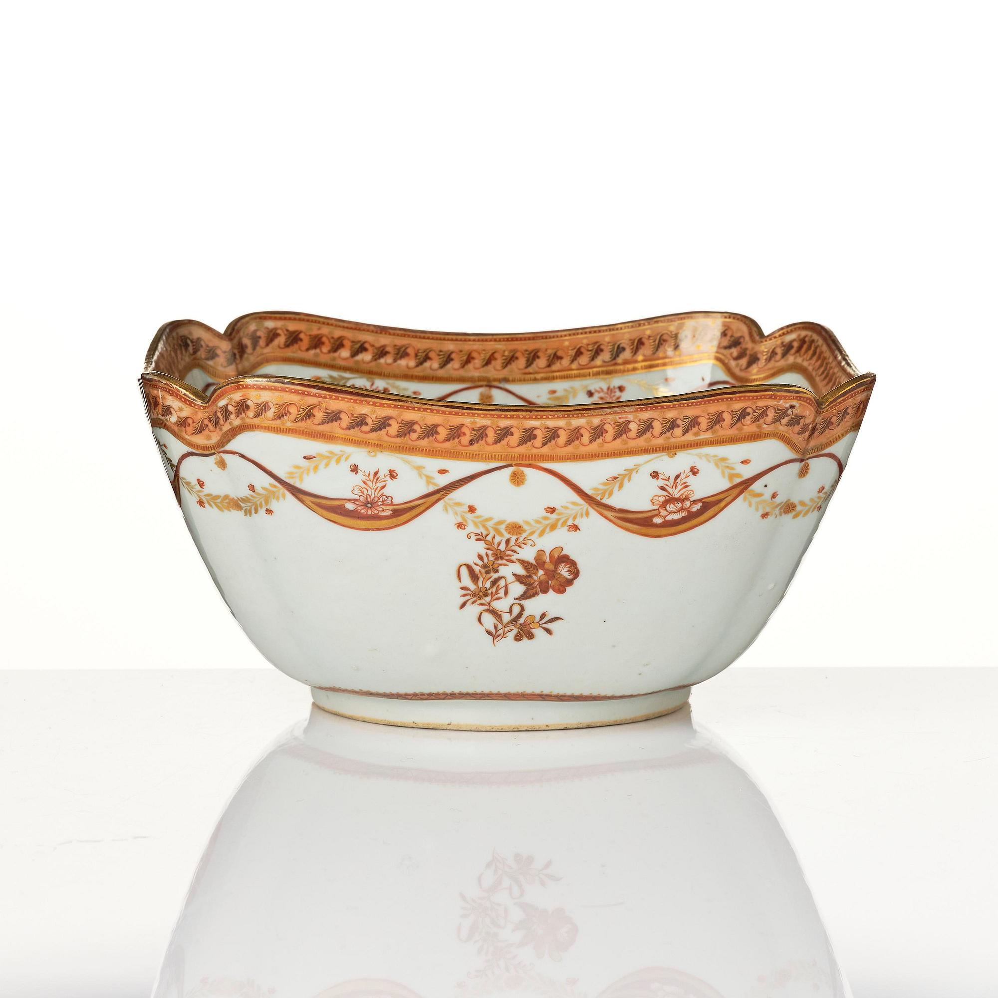 An oval vegetable tureen with cover and a pillow shaped bowl, Qing dynasty, late 18th century.