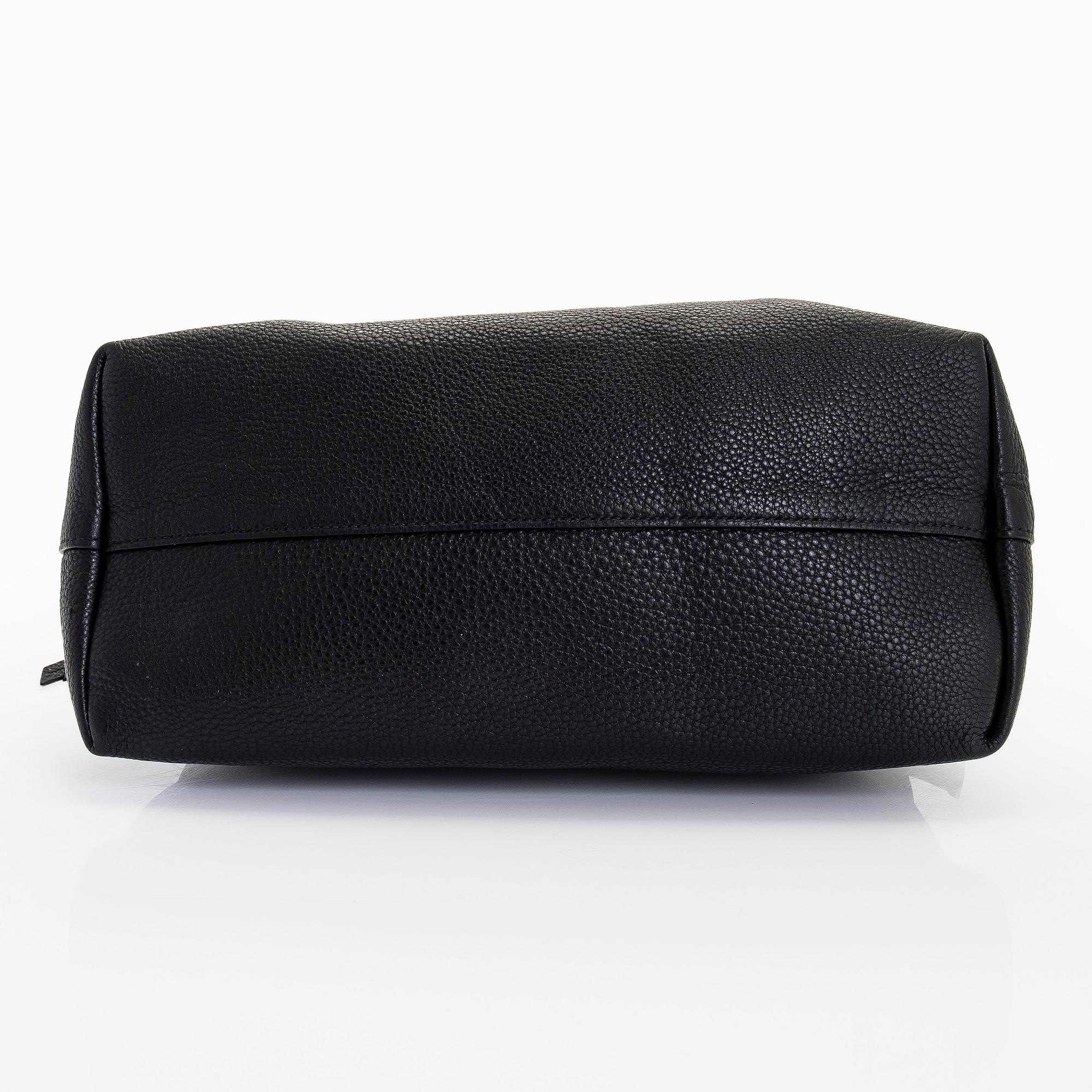 Prada, a leather bag.