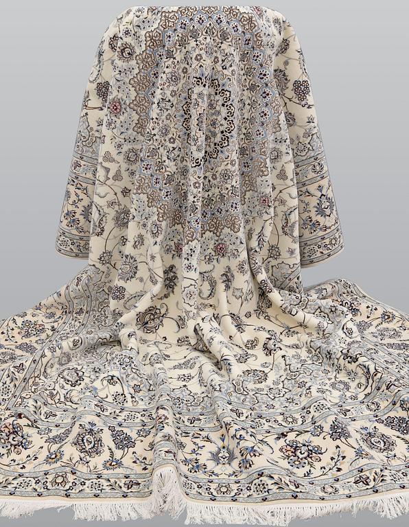 A Nain part silk carpet, 408 x 308 cm.