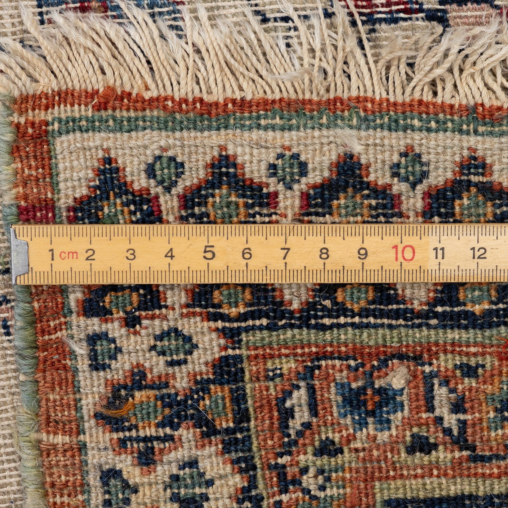 An antique Doroshk carpet, East Persian, c. 406 x 295 cm.