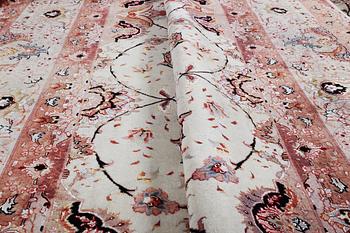A carpet, Tabriz, part silk, 50 Raj, ca 340 x 253 cm.