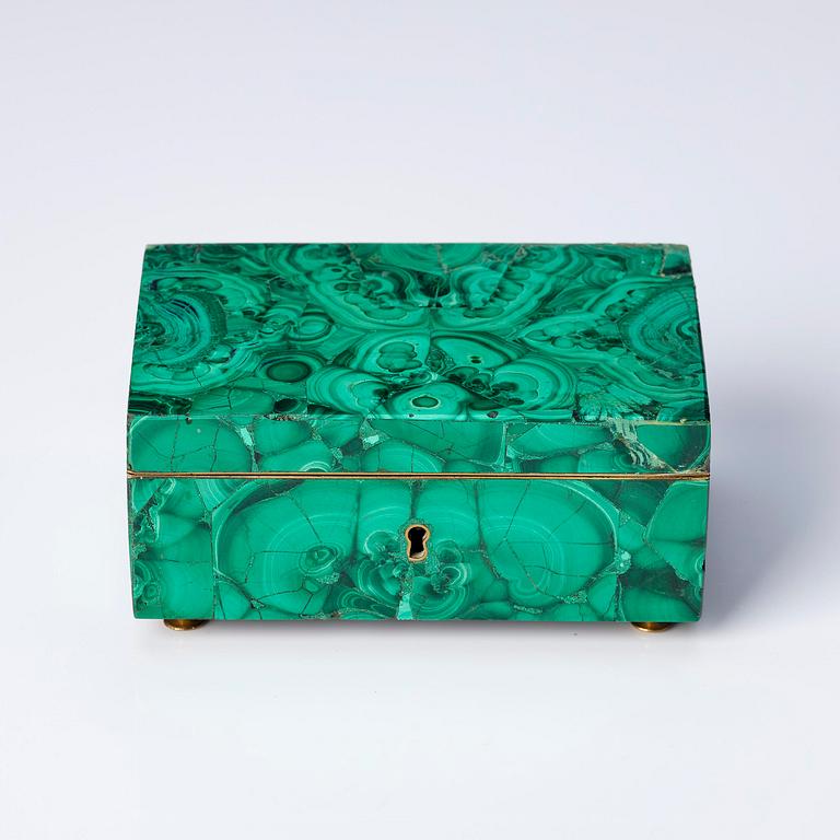 A Russian Nicholas II malachite-veneered box, circa 1900.