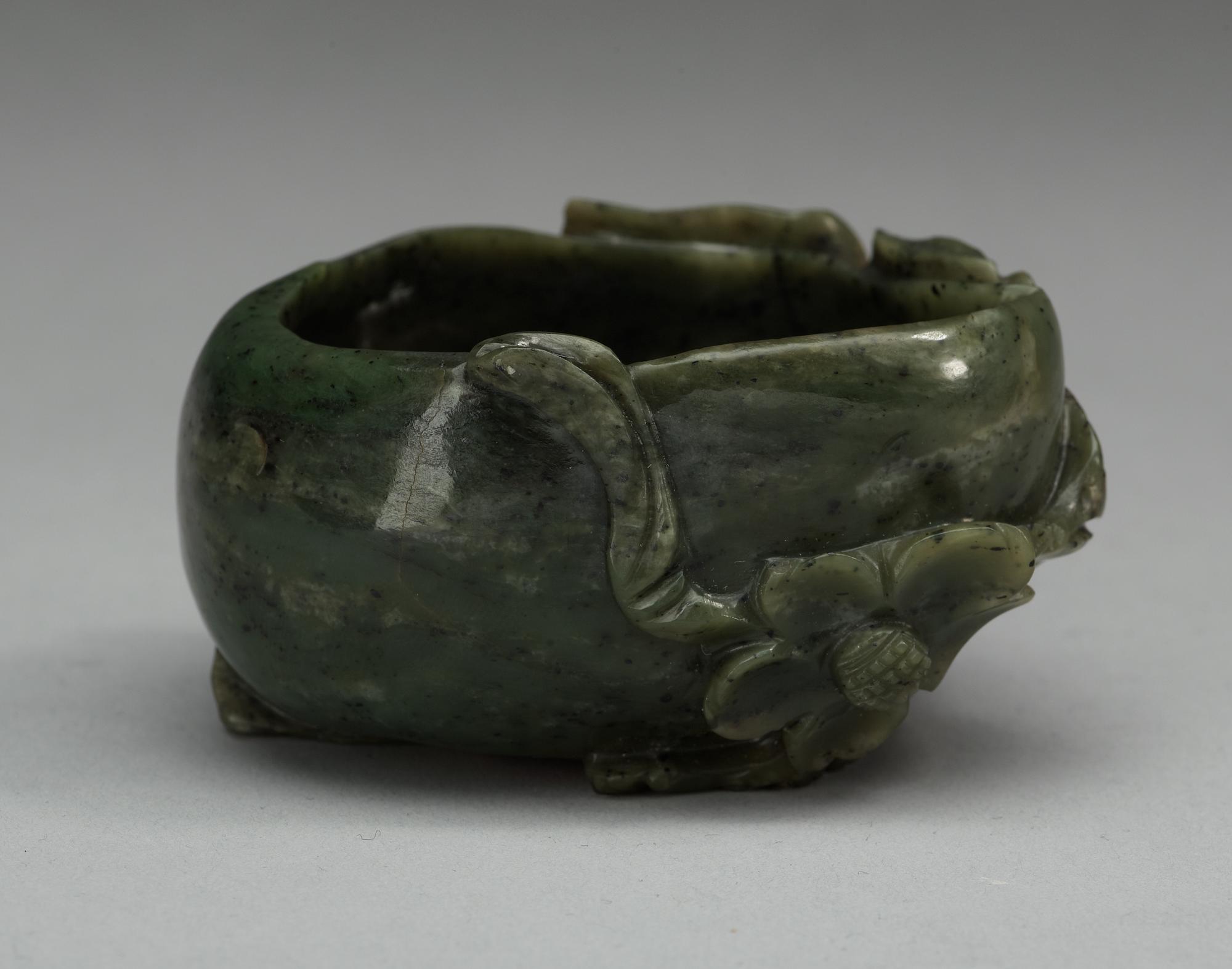 A carved nephrite brush washer, Qing dynasty.