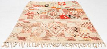 A Moroccan crpet, c. 240 (+7+8 cm flat weave) x 151 cm.