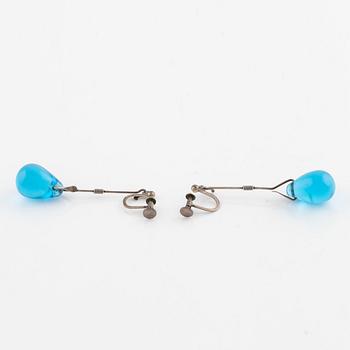 A pair of silver earrings with blue glass drops, likely by Torun Bülow-Hübe.