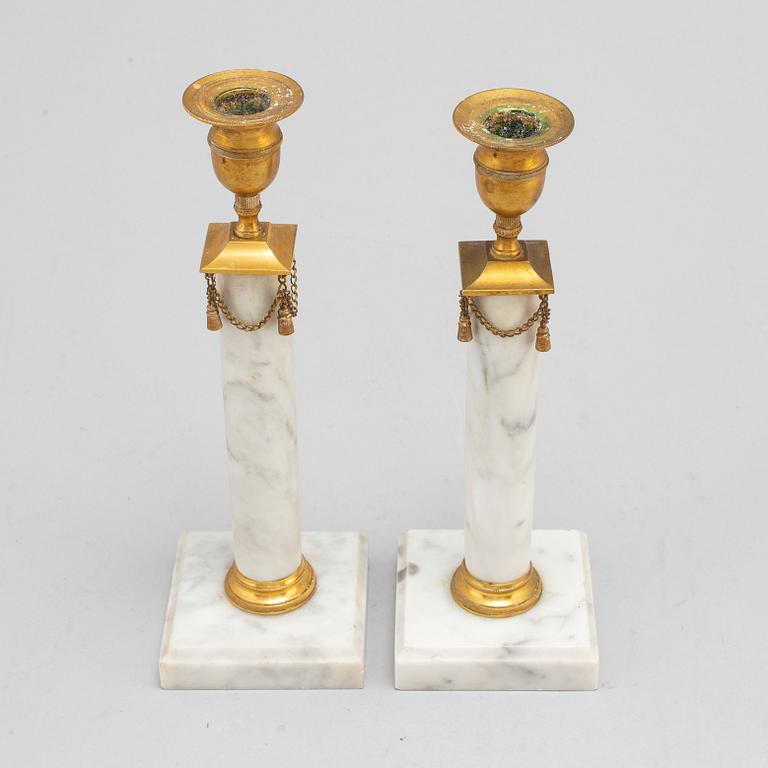 A pair of Gustavians style marble candlesticks, early 20th Century.