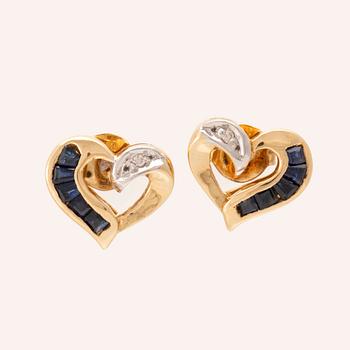 Bucherer örhängen 18K vitt och rött guld med runda briljantslipade diamanter samt blåa stenar.