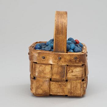 An Ingrid Herrlin stoneware blueberry basket with two lingonberries, Båstad, Sweden.