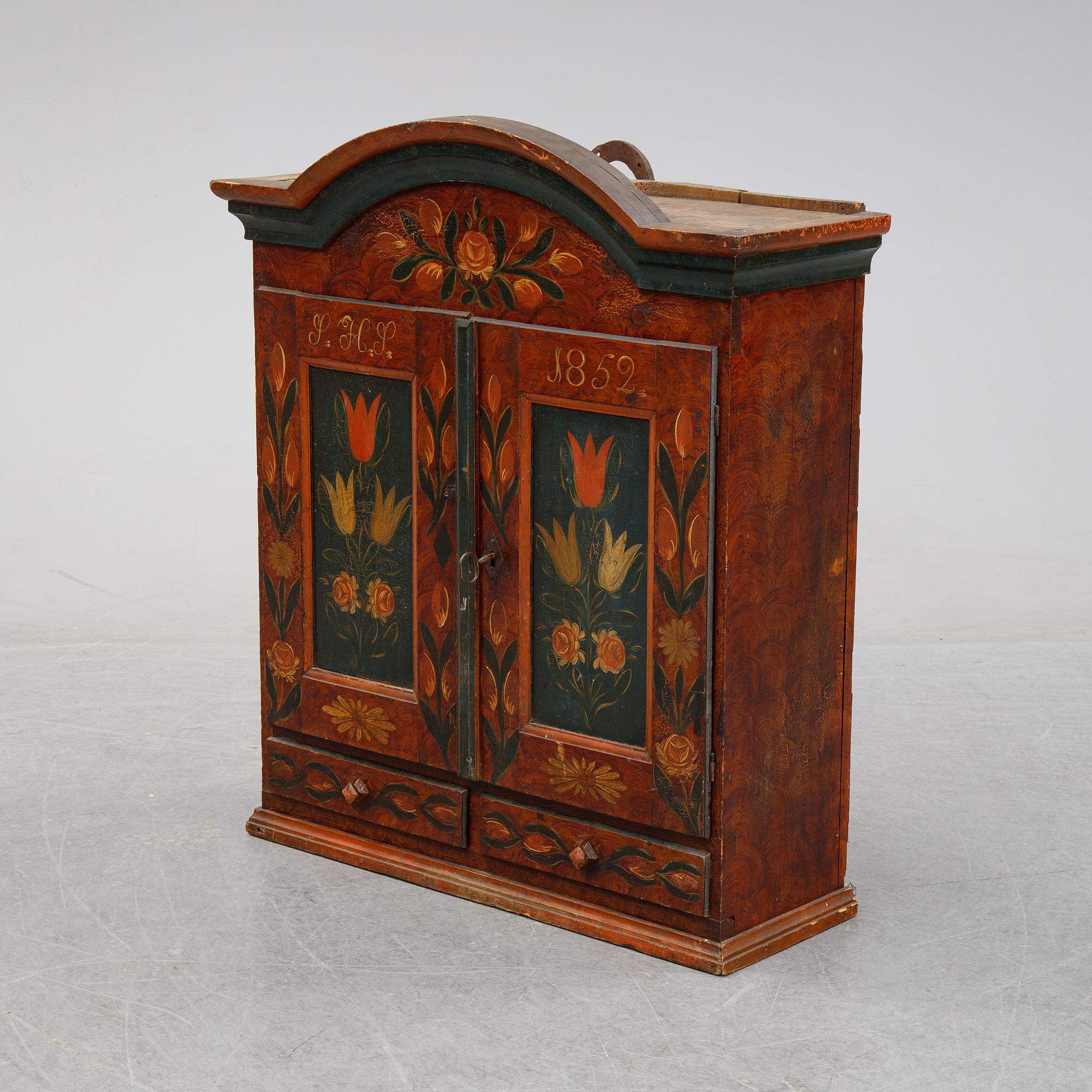 A Swedish provincial painted wall hanging cabinet, dated 1852.