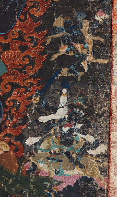 A Tibetan Thangka of Mahakala surrounded by fierce Dharma protectors, 19th century.