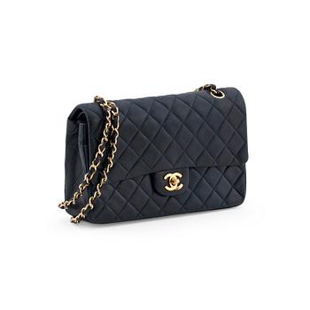 909. CHANEL, a quilted blue leather "Double Flap" shoulder bag.