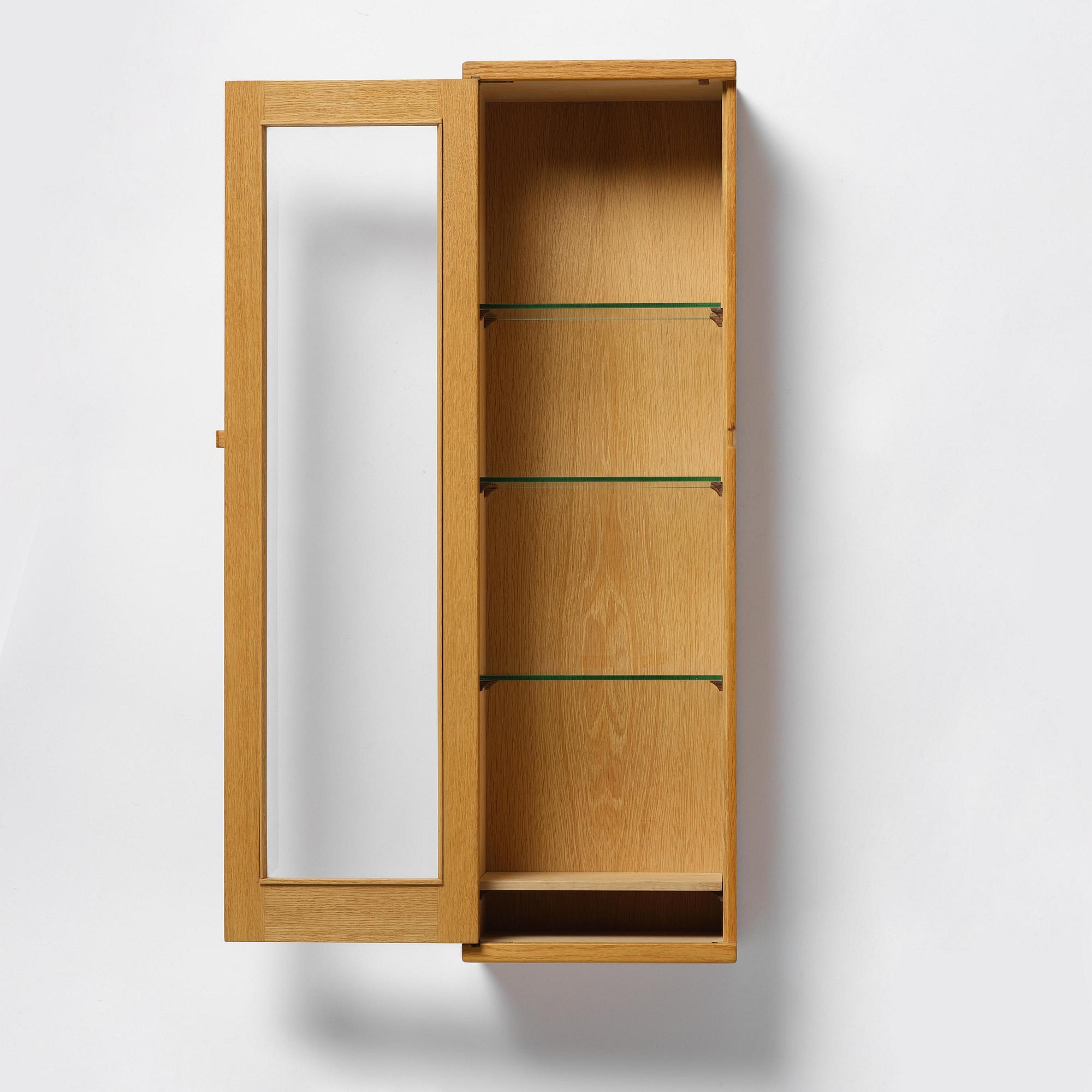 James Krenov, an oak or doussie showcase wall cabinet, executed in his own workshop, Bromma, Sweden.