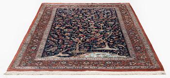 A signed pictoral silk Qum rug, c. 203 x 127 cm.