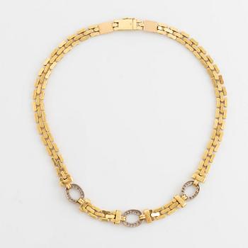 18K gold and round brilliant cut diamond necklace.