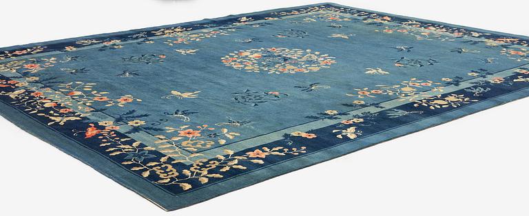 An antique Beijing carpet, northern China, c. 365 x 294 cm.