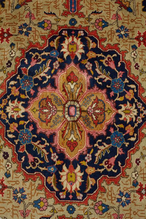 A CARPET, a semi-antique Tabriz, ca 342 x 269 cm.