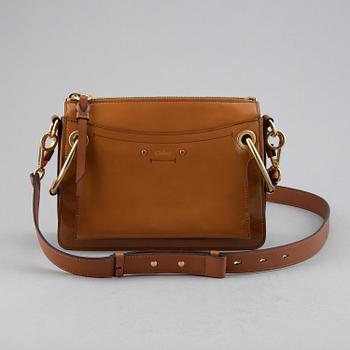 CHLOÉ, a small caramel 'Roy bag'.