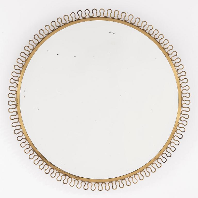 A mid 20th century brass frame mirror.