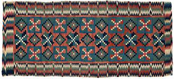 296. A CARRIAGE CUSHION, double-interlocked tapestry, "Åttabladsstjärnor", ca 46,5 x 104 cm, Scania (Sweden) around 1800.