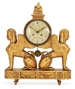 627. A late Gustavian gilt wood mantel clock by W. Pauli.