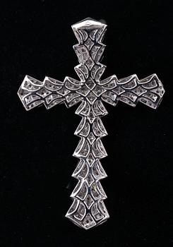 A CROSS,  brilliant and baguette cut diamonds c. 6.50 ct. Weight 14,3 g.