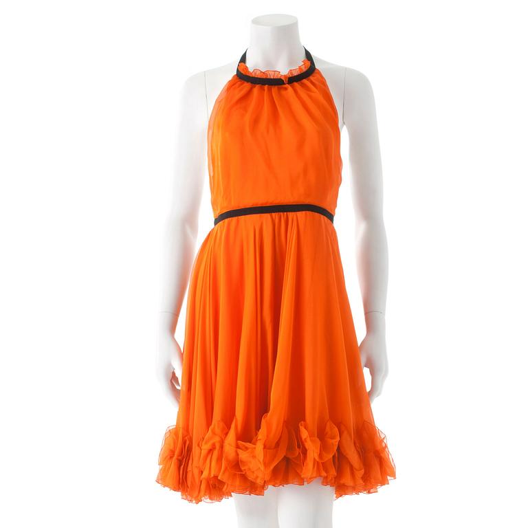 DOLCE & GABBANA, an orange silk cocktail dress.