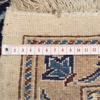 A Nain carpet, c. 295 x 190 cm.